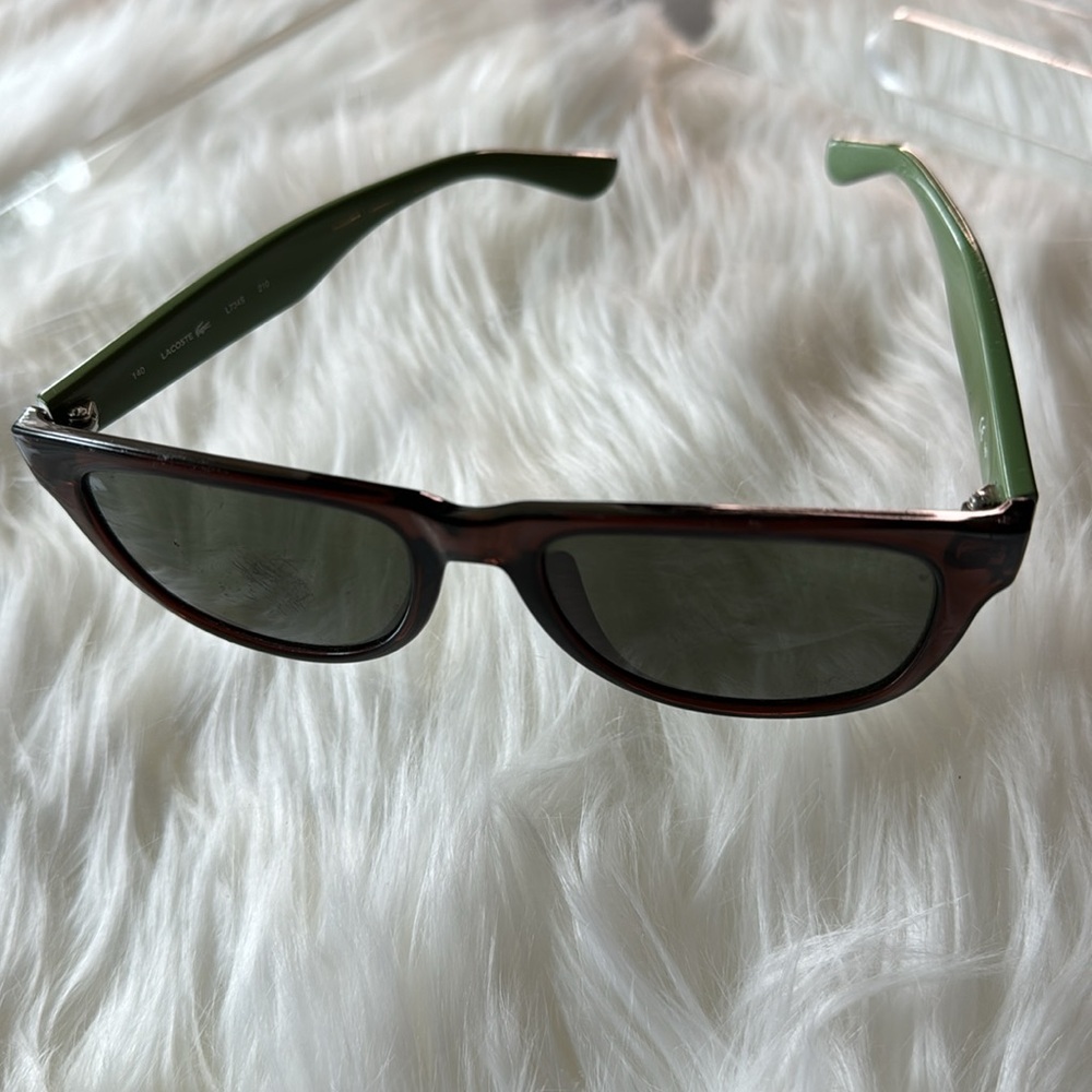 Lacoste L734s Wayfarer Sunglasses, lens have scratches, hence the price.